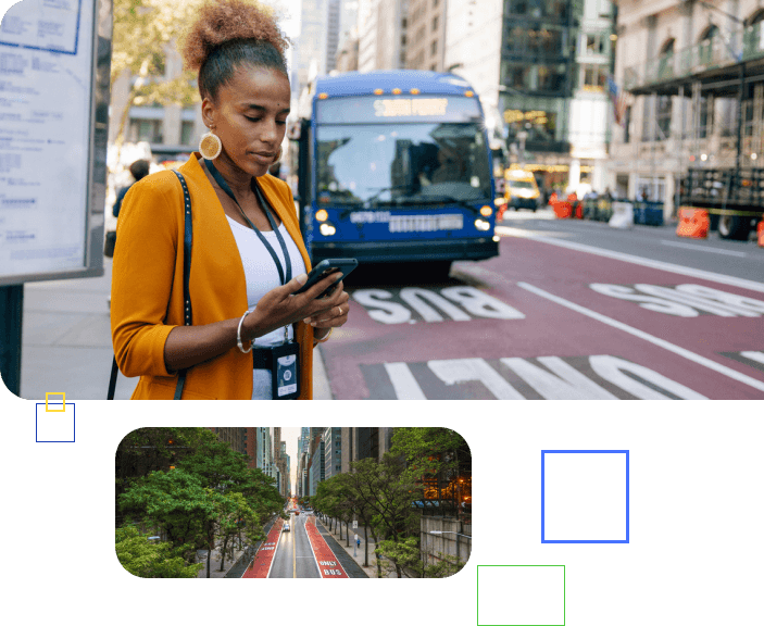 A woman stands at the bus stop as the bus approaches