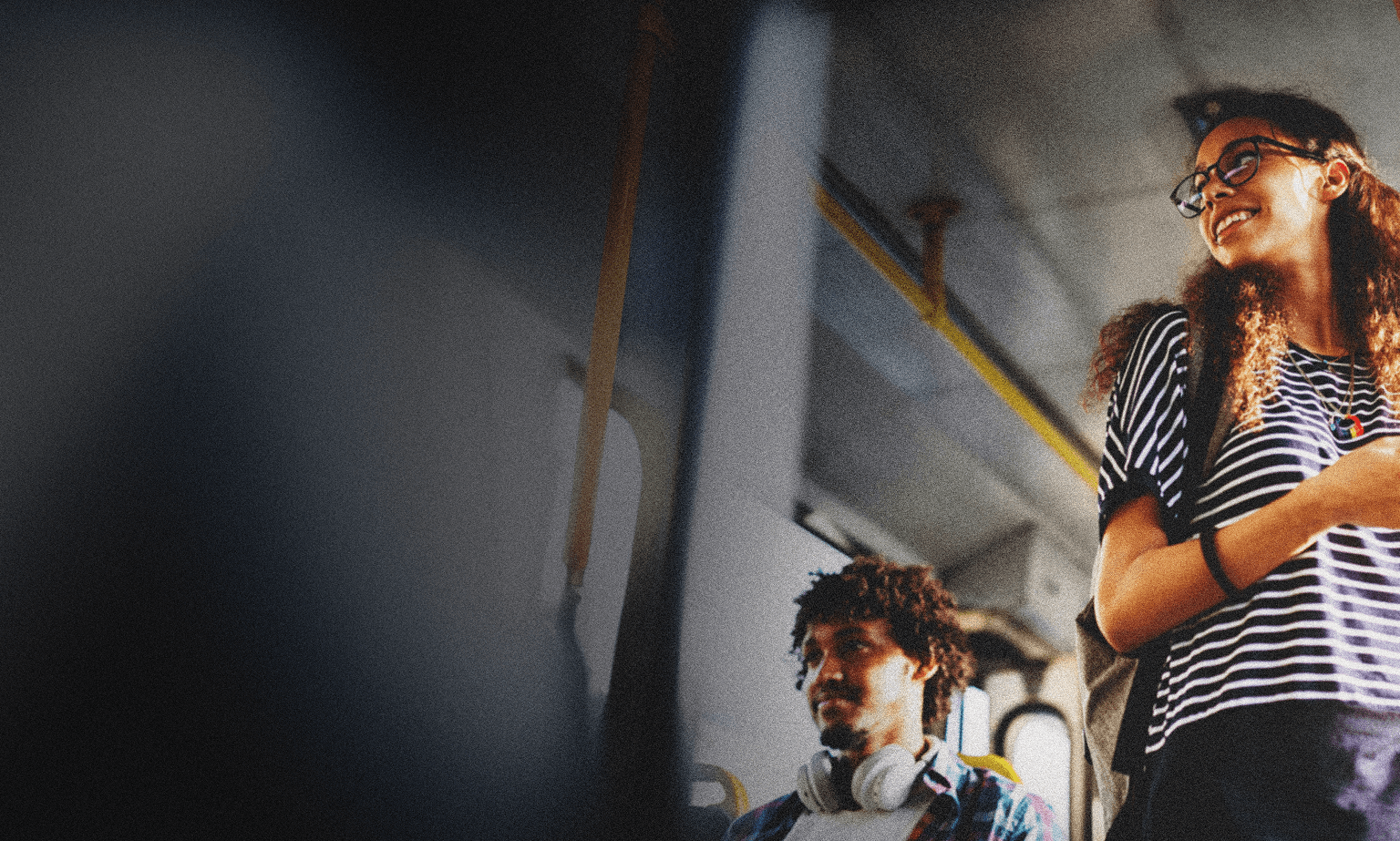 Two people riding the bus