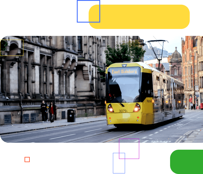 A tram turning in front of traffic within a city street